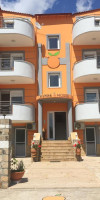 Orange House Apartments & Suites