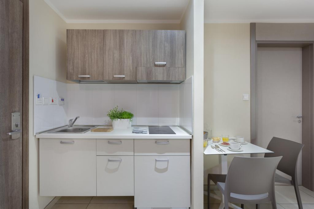 115 THE STRAND HOTEL AND SUITES
