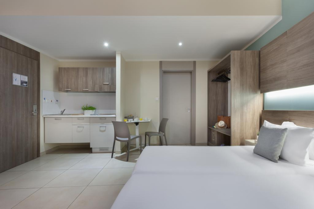 115 THE STRAND HOTEL AND SUITES