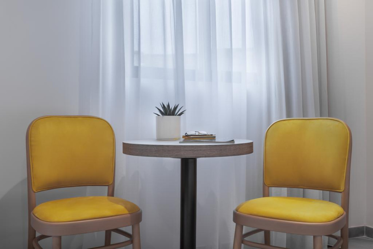115 THE STRAND HOTEL AND SUITES
