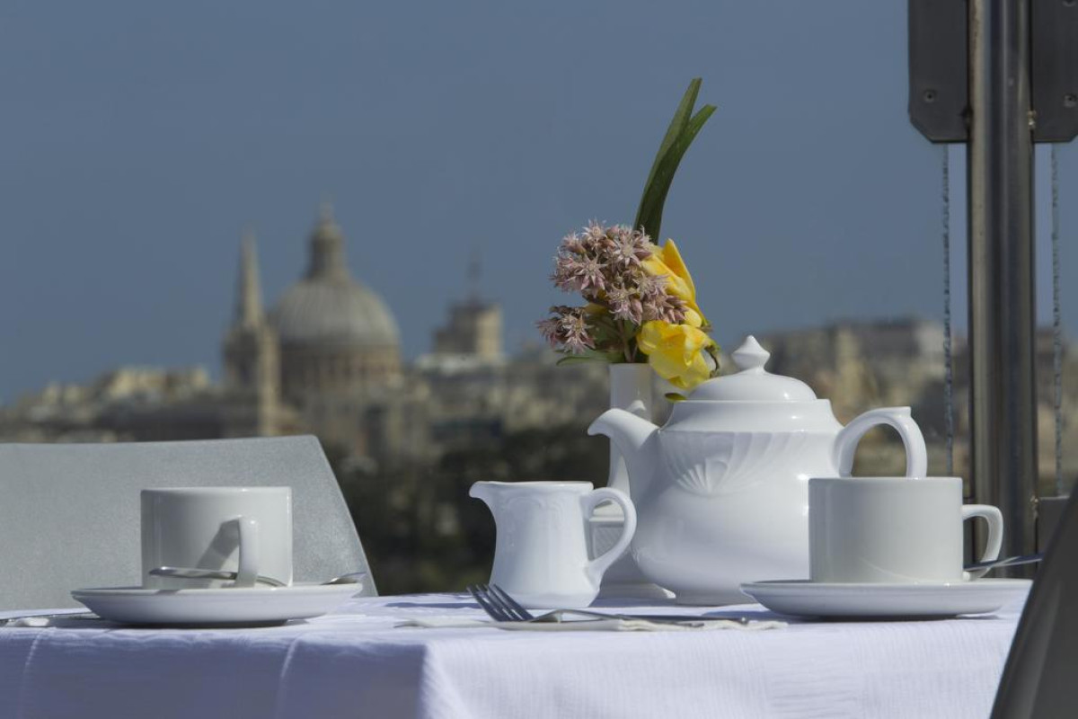 115 THE STRAND HOTEL AND SUITES
