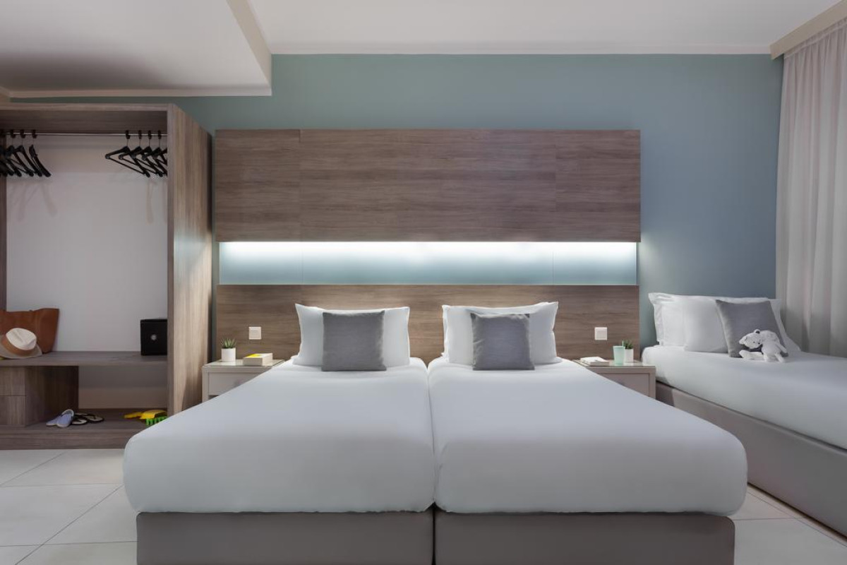 115 THE STRAND HOTEL AND SUITES