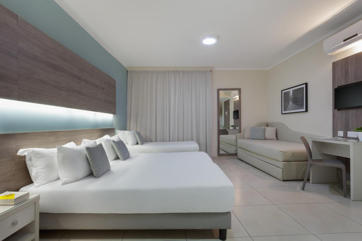 115 THE STRAND HOTEL AND SUITES