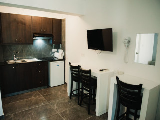 A. MAOS HOTEL APARTMENTS